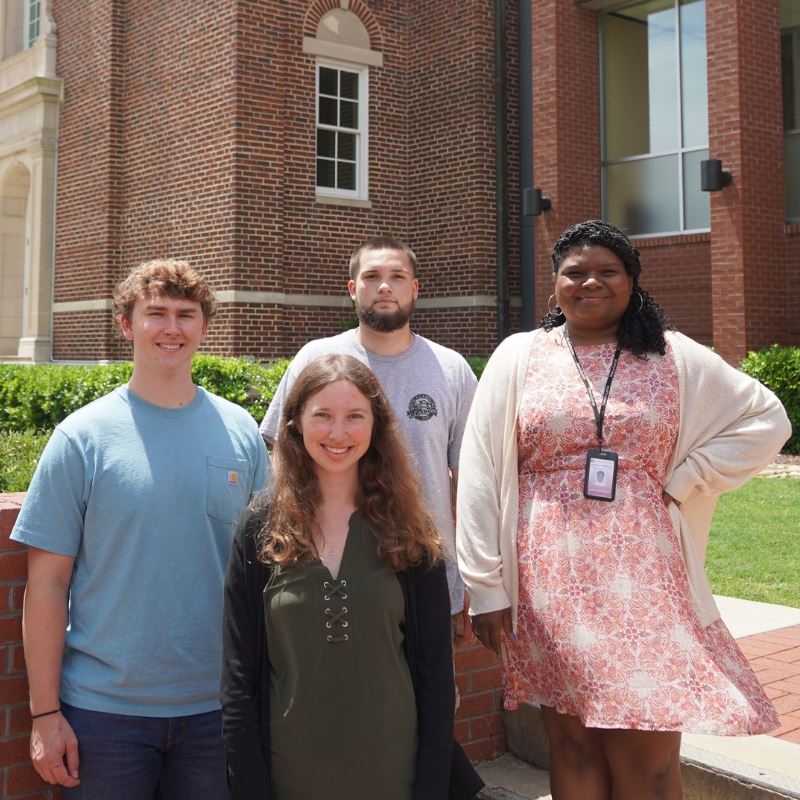 Interns Tucker Whitley, Aniston Boswell, Hayden Probst and Jessica Watkins pose at Town Hall
