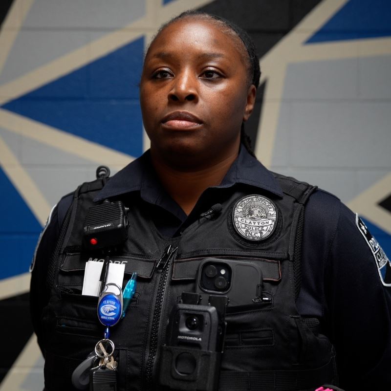 School Resource Officer Tomeka Moore Stand in Clayton School Hallway